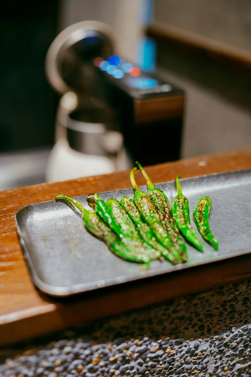 Fushimi and shishito peppers, still on the vine, ready to blister