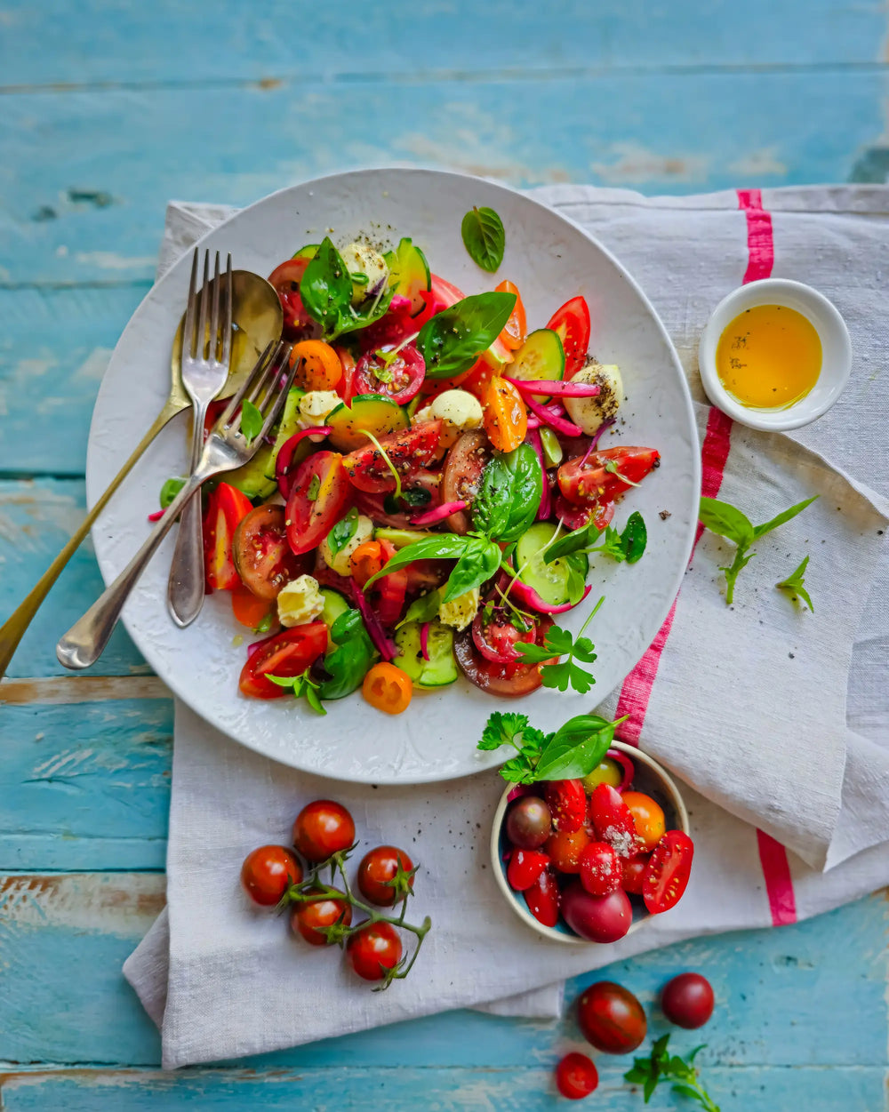 Heirloom tomato caprese salad, sliced rounds in colour